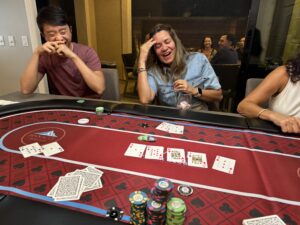 Daniela laughs as she hits an unlikely flush on the river to barely survive in Event 5